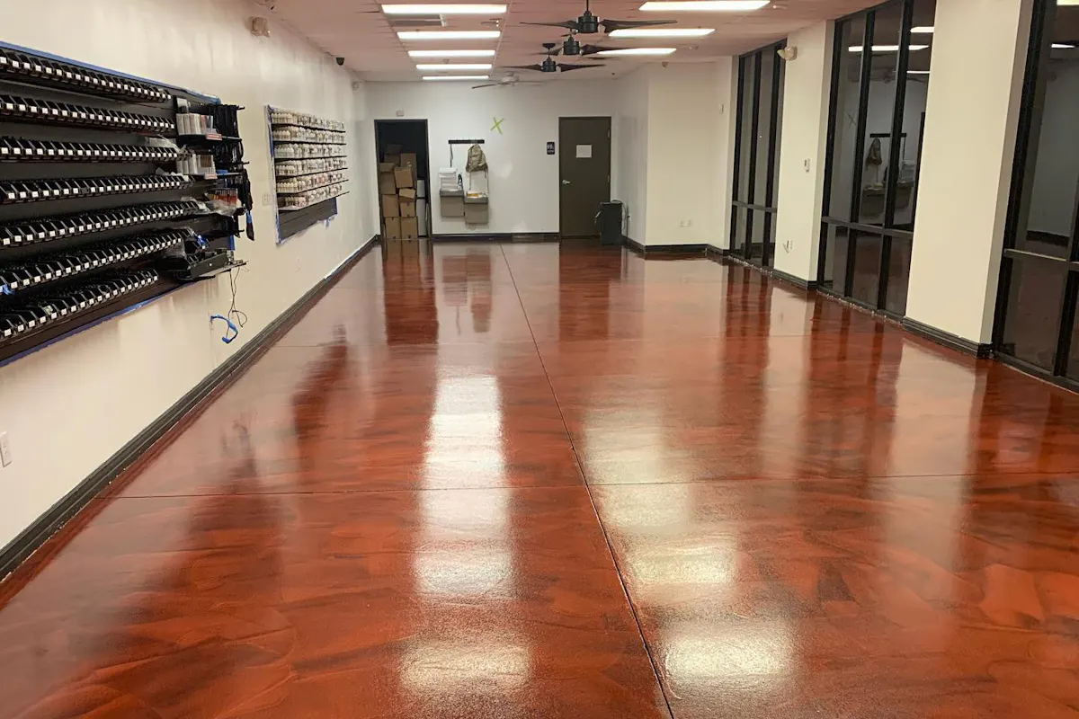 Commercial interior with glossy reddish-brown metallic epoxy floor coating