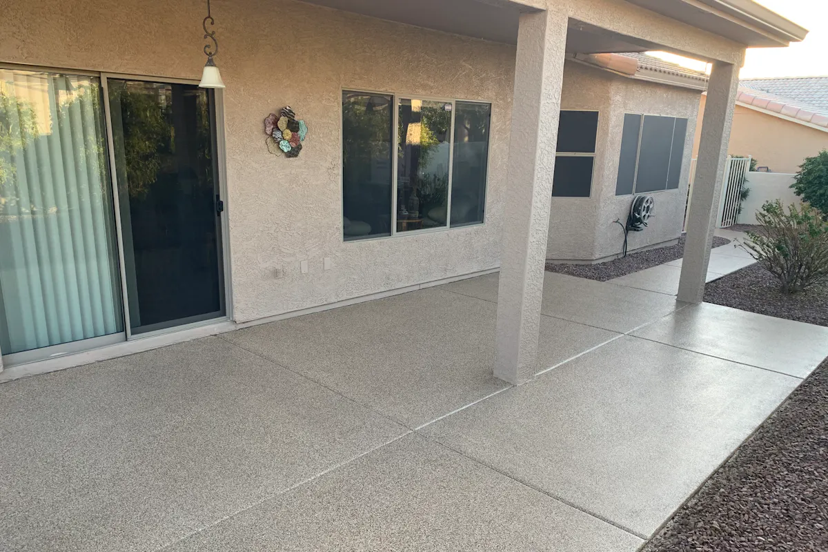 Residential covered patio before coating bare concrete panels Arizona home exterior