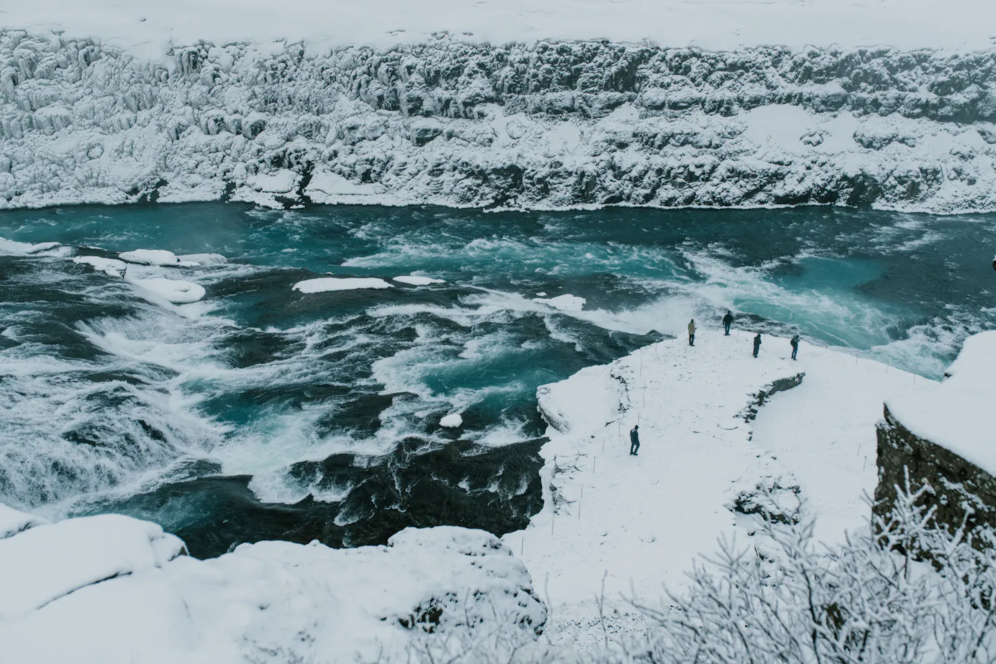 The Gullfoss waterfall in Iceland framed by snow and ice in winter