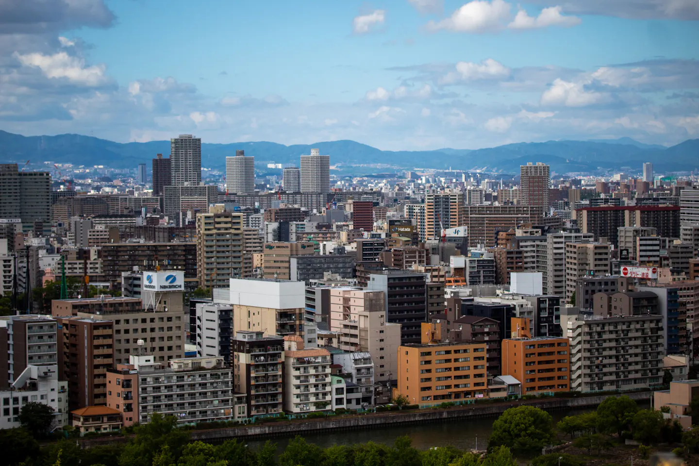 An Osaka skyline with illuminated high-rises