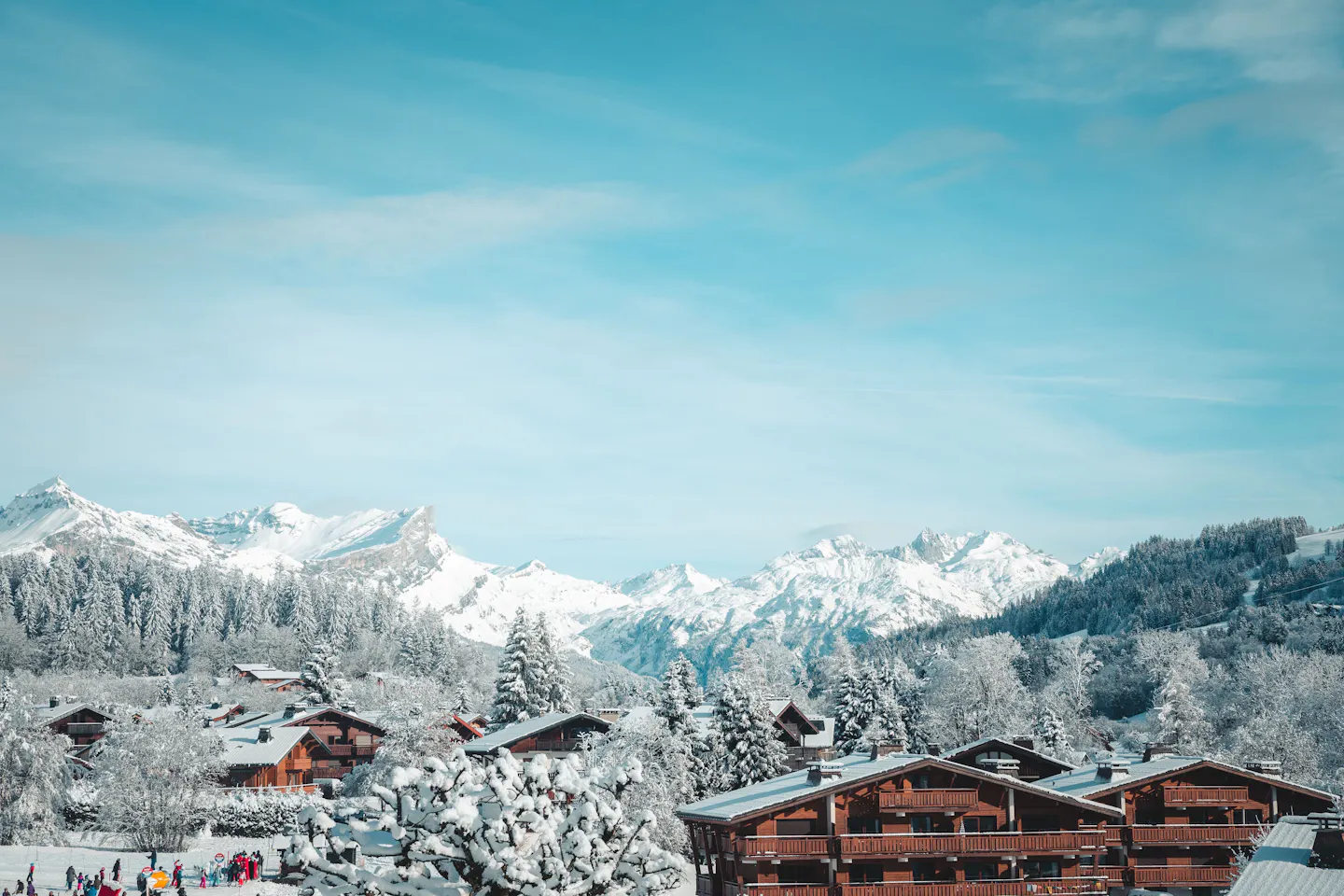Snow-covered chalets in Megève below the Alps