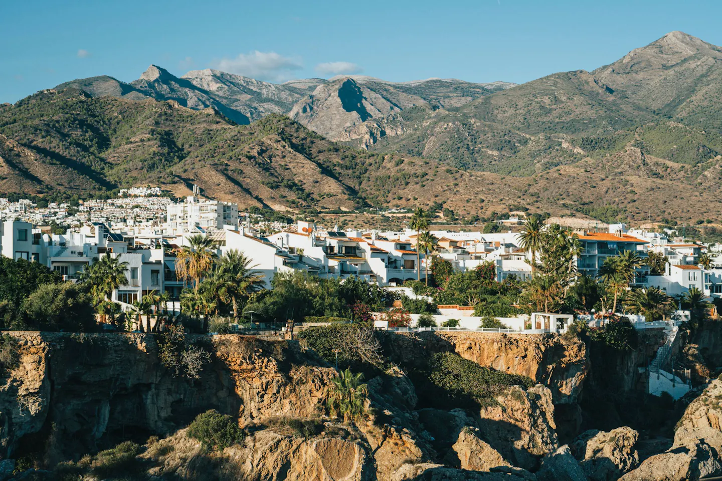 The white houses of Nerja on the Costa del Sol below the bare peaks of the Sierra Almijara