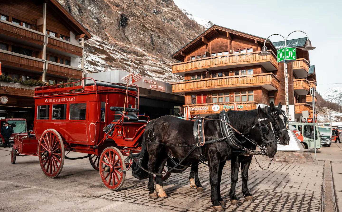 Horse-drawn carriage in Megève, France, beneath the resort’s chalet-style hotels
