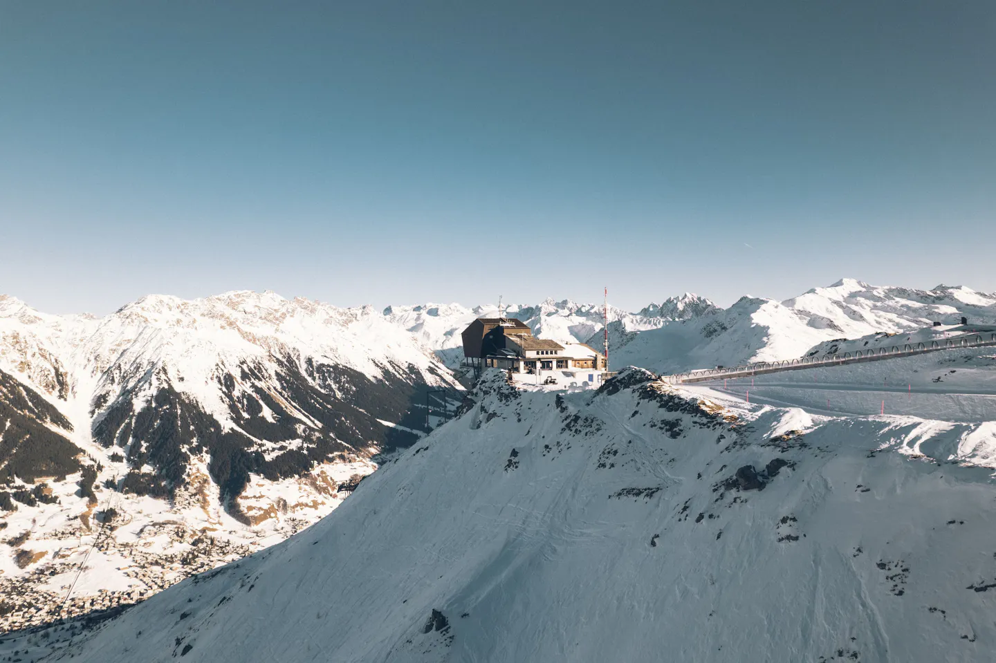 Verbier, Switzerland, a mountain-top building above snow-covered Alpine slopes