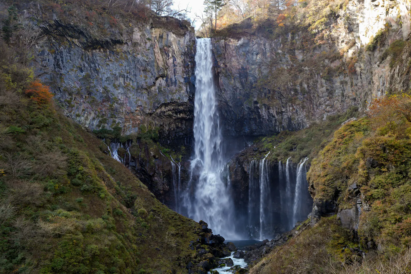 Kegon Falls dropping into a gorge lined with autumn foliage near Nikko
