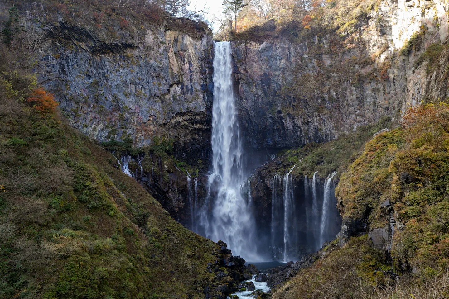 Kegon Falls dropping into a gorge lined with autumn foliage near Nikko