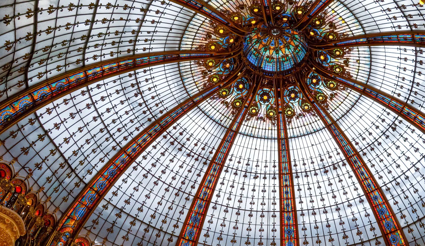 The Art Nouveau stained-glass dome of Galeries Lafayette seen from directly below