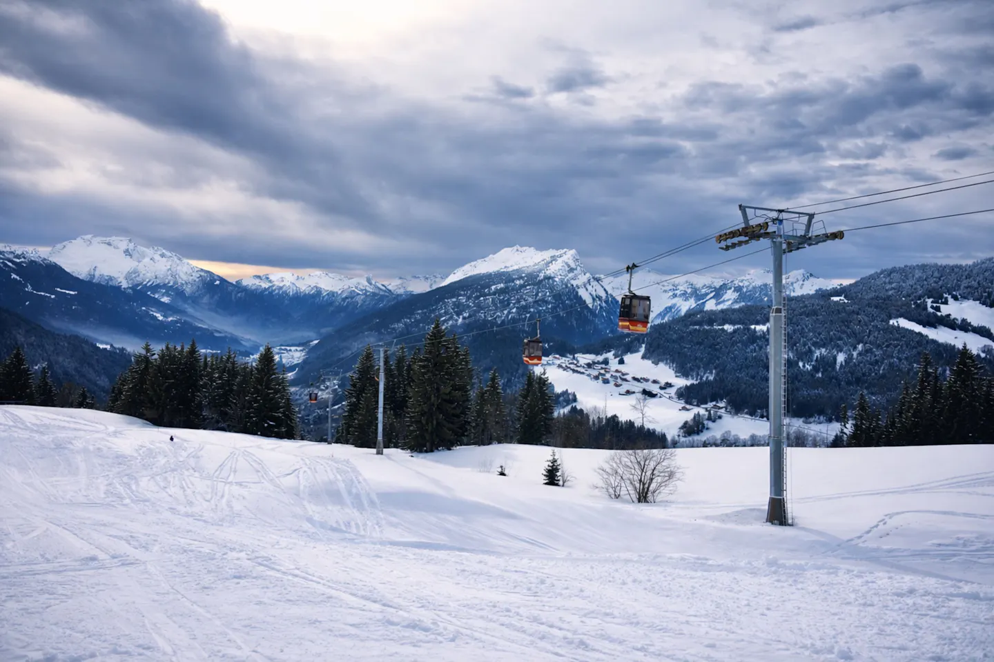 Snowy ski slopes and a gondola lift in Megève, near Four Seasons Hotel Megève