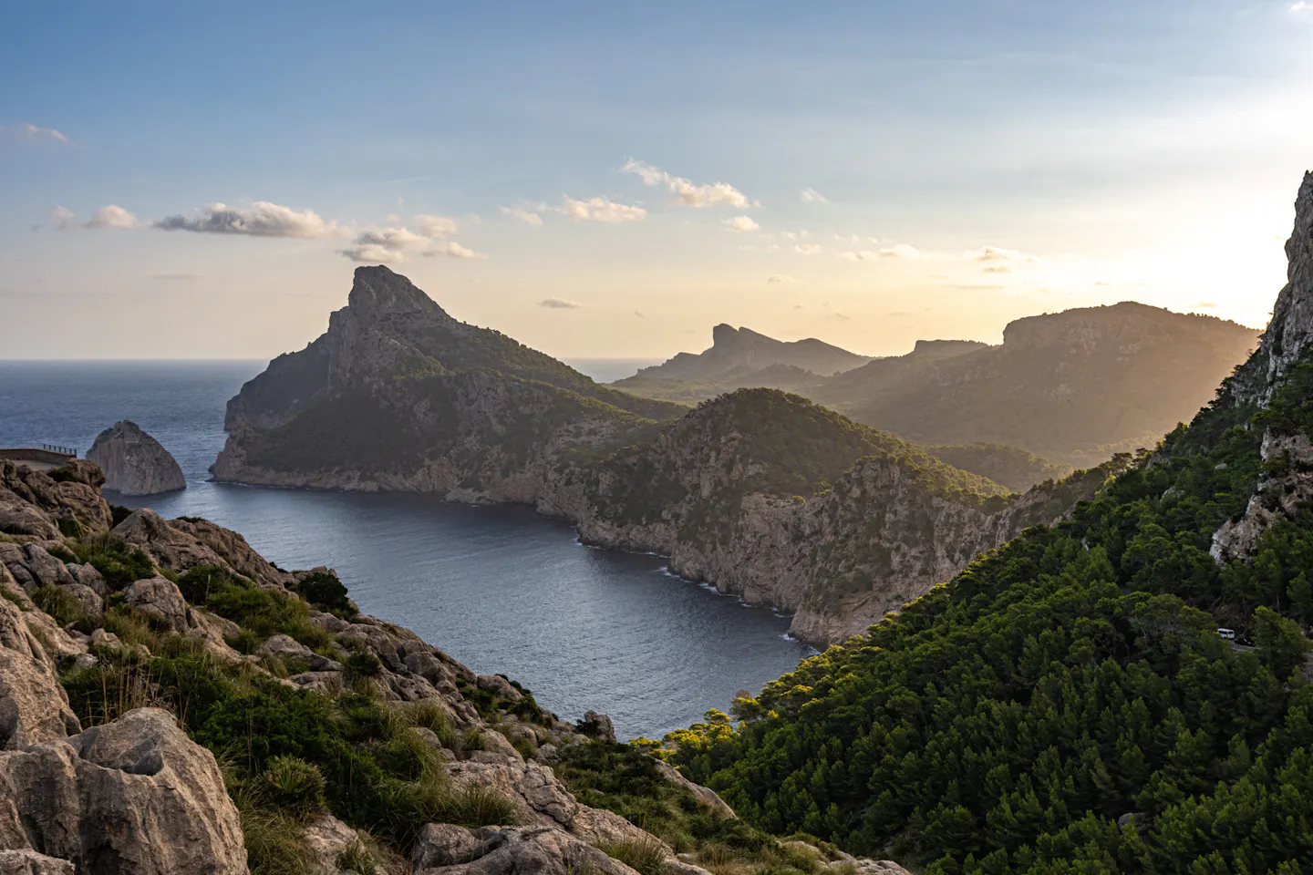 The headlands of Cap de Formentor on Mallorca backlit by the setting sun above the Mediterranean