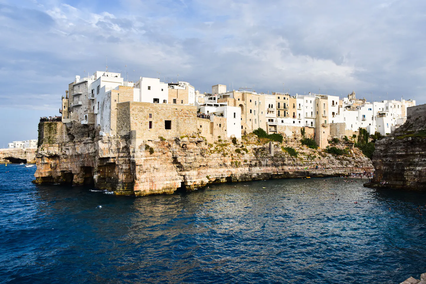 The white houses of Polignano a Mare standing on limestone cliffs above the Adriatic in Puglia