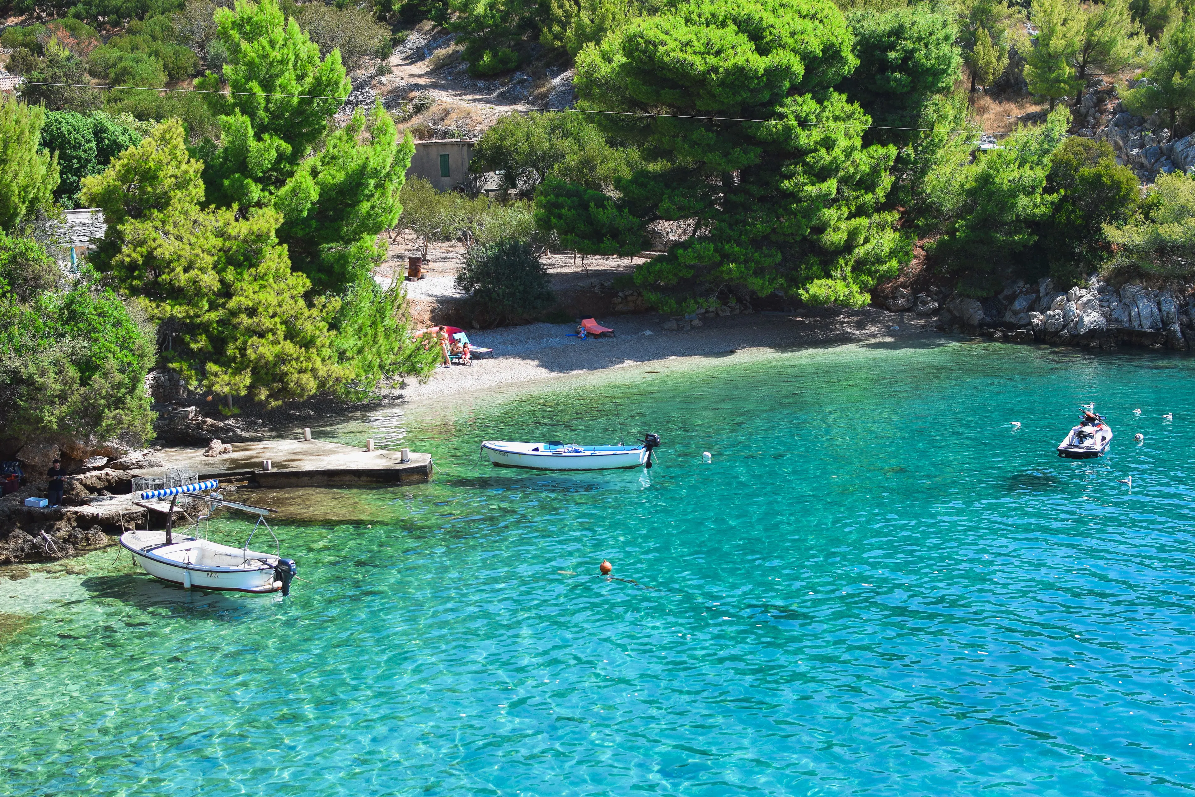Secluded rocky cove with clear turquoise water on the Croatian coast