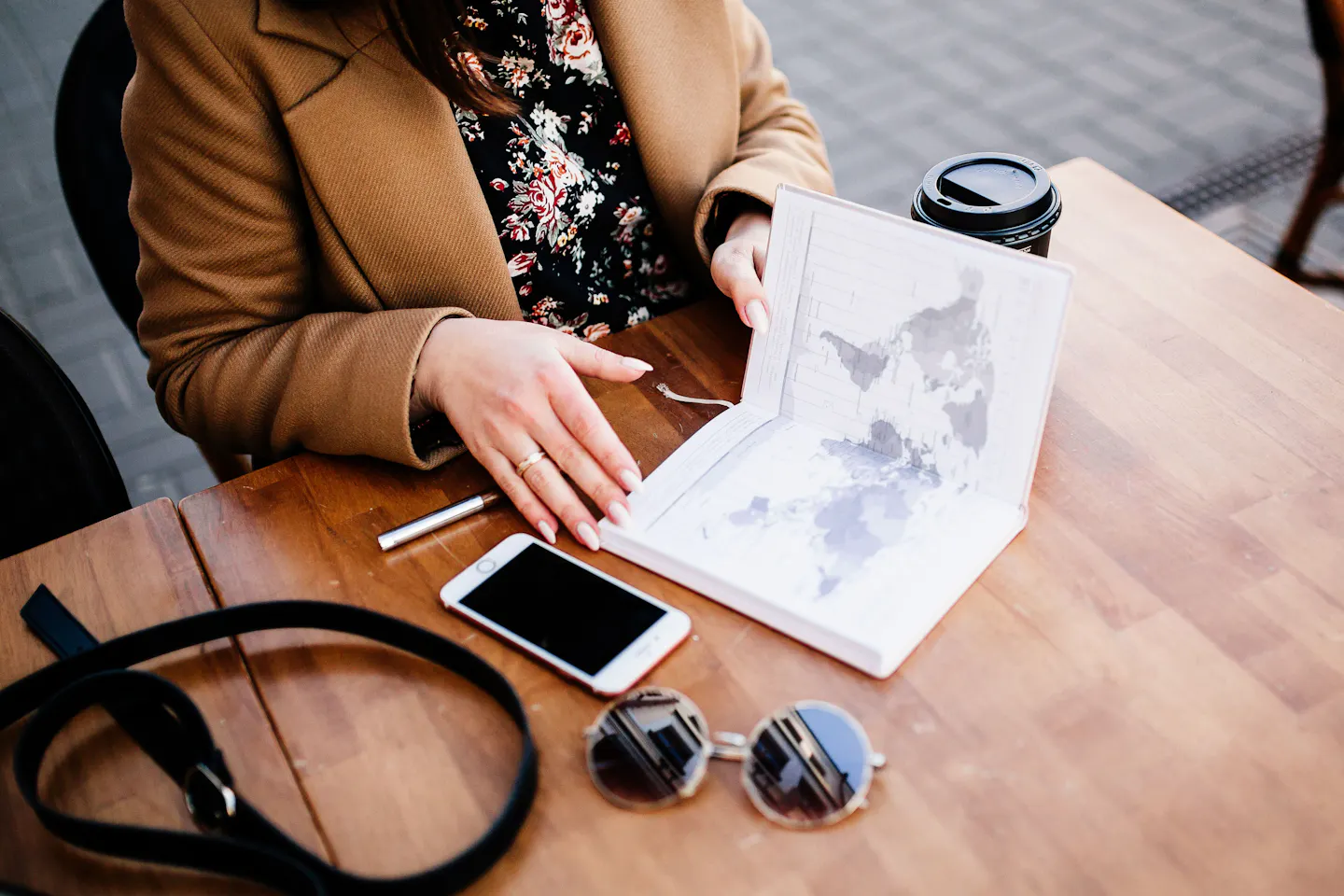 A traveler planning a trip with a map and notebook