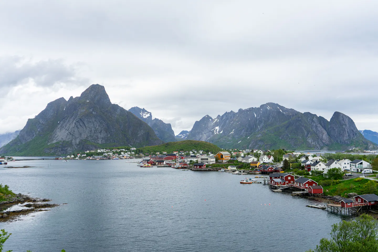 Aerial view of Reine village, its harbour and surrounding peaks in Lofoten, Norway