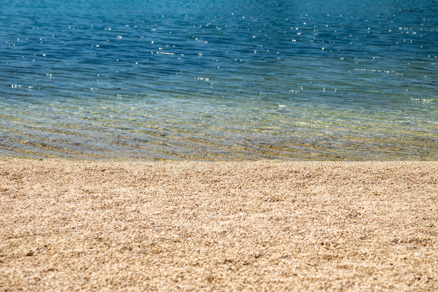 Pebble beach meeting clear water on the Croatian Adriatic coast