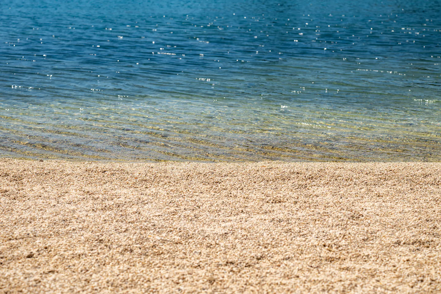 Pebble beach meeting clear water on the Croatian Adriatic coast