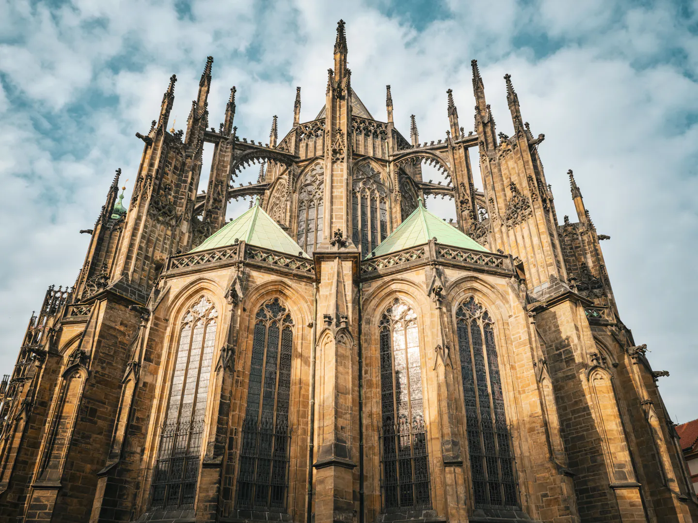 The Gothic flying buttresses and pinnacles of St Vitus Cathedral in Prague against a dramatic sky