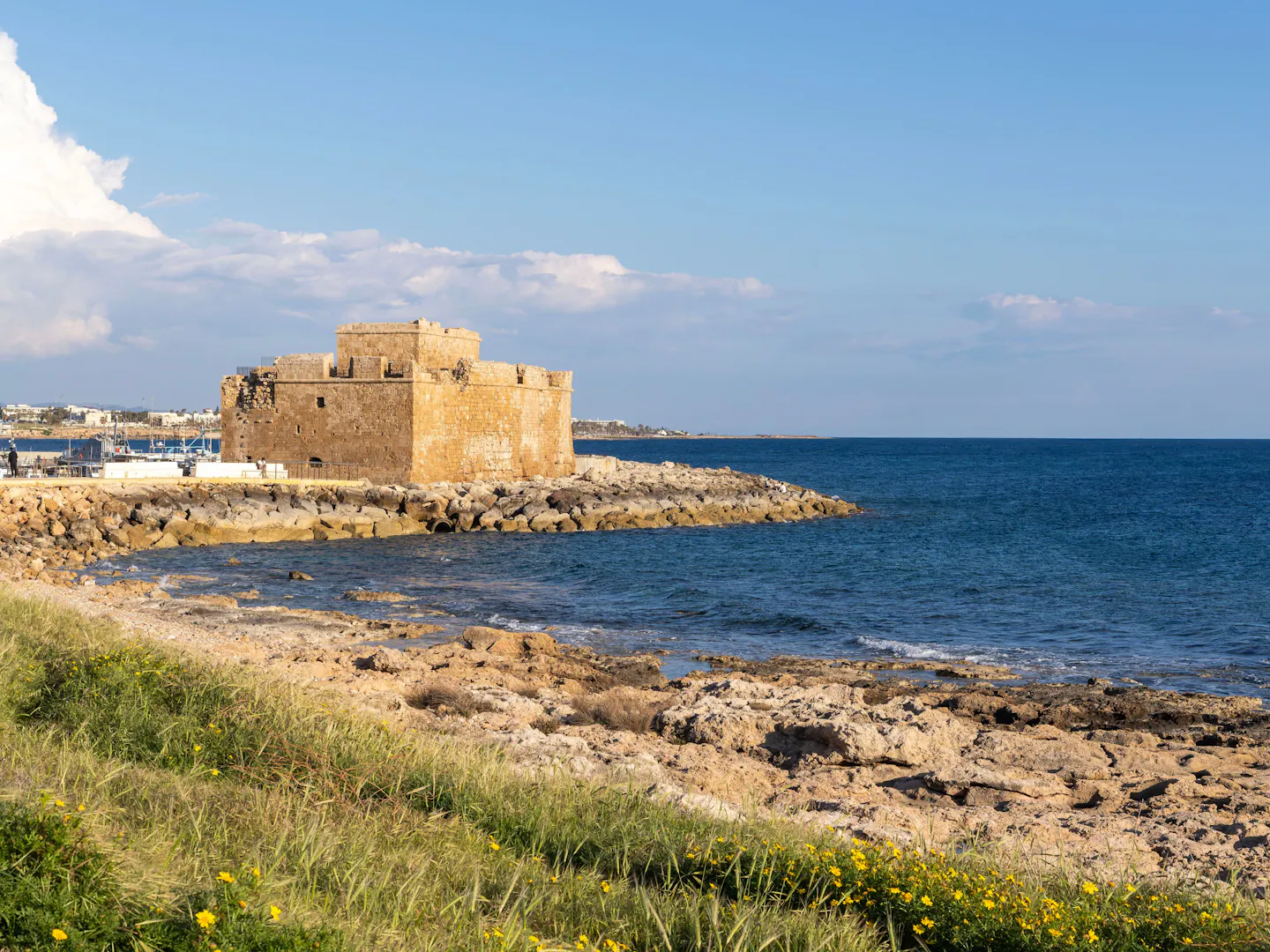 The medieval fort at Paphos harbour above the sea under a clear blue Cypriot sky