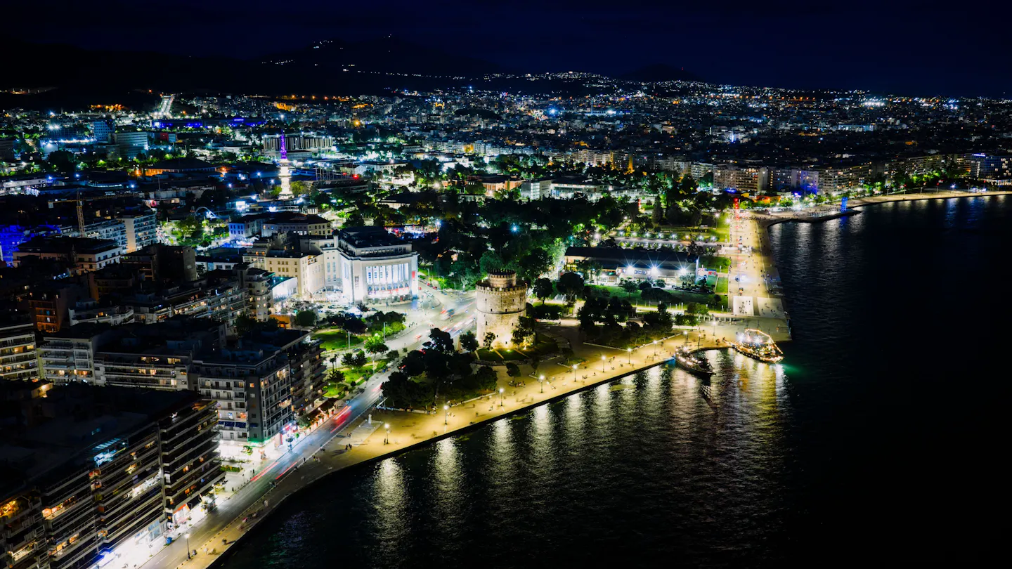 Night aerial view of Thessaloniki with the illuminated White Tower on the waterfront