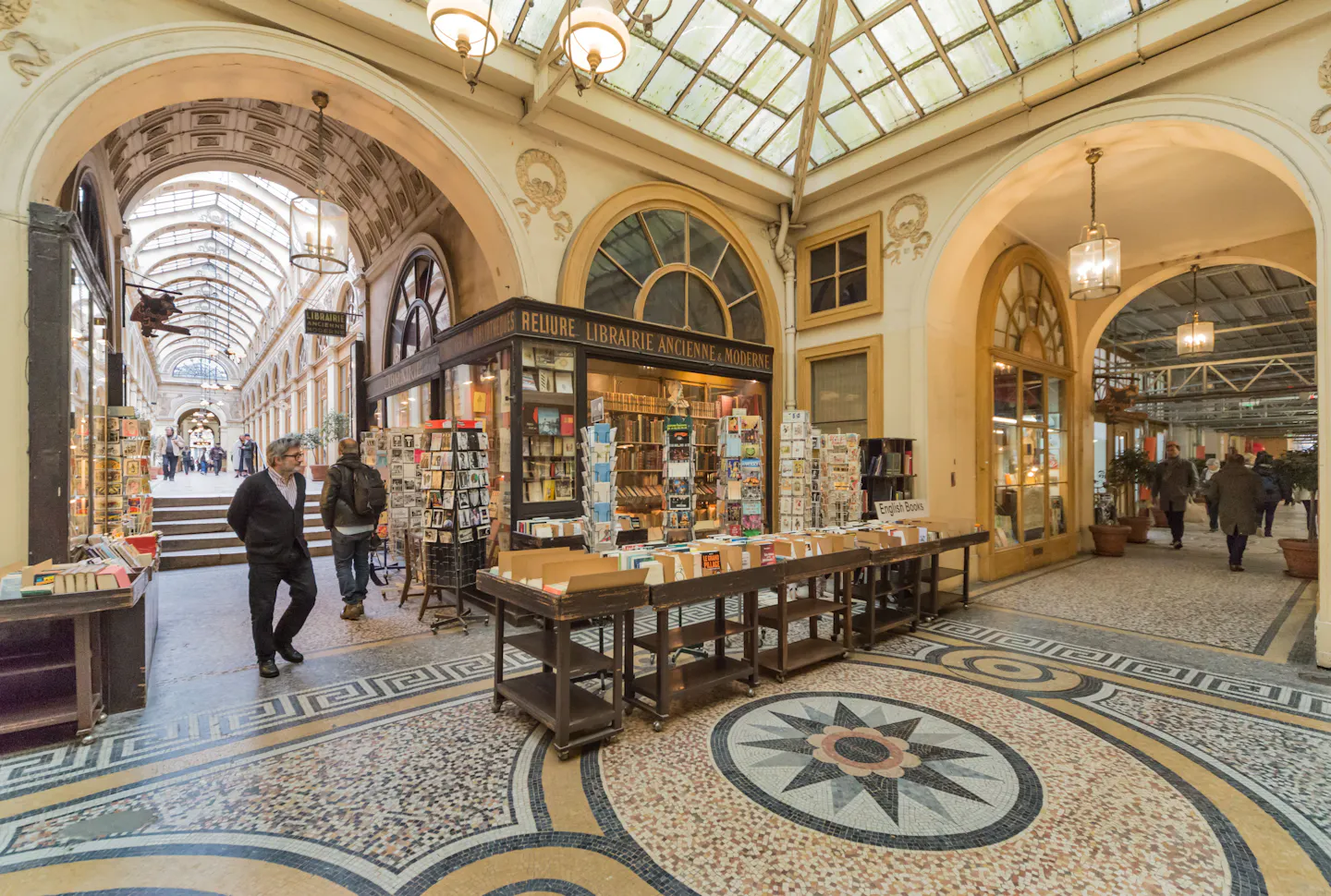 The mosaic floor, glazed roof and old bookshop of the Galerie Vivienne covered passage in Paris