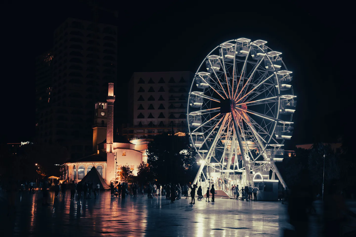 Tirana’s Skanderbeg Square Ferris wheel glowing at night