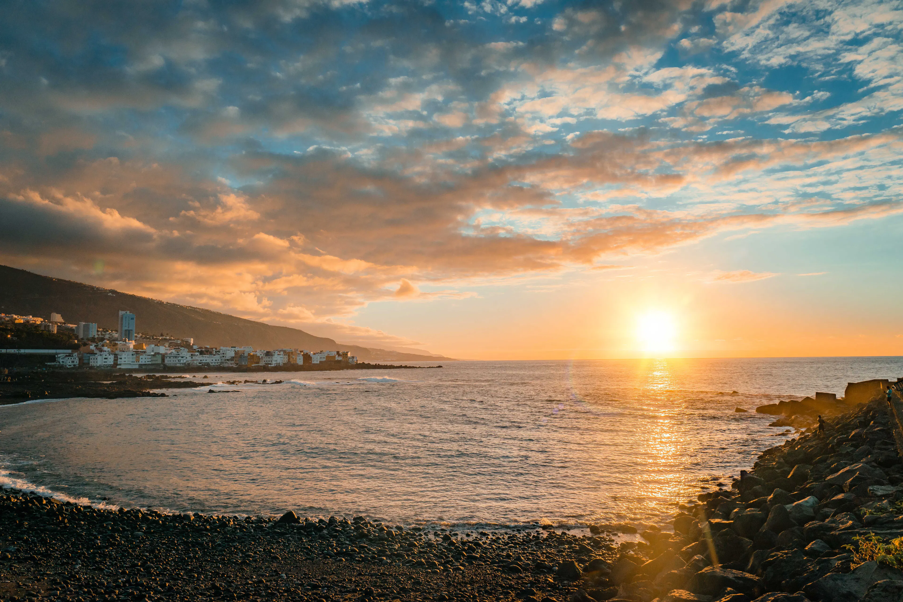 Sunset over the Atlantic and the coastal town of Puerto de la Cruz in northern Tenerife