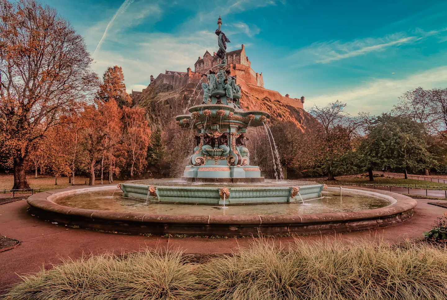 The Ross Fountain in Princes Street Gardens below Edinburgh Castle in autumn colour