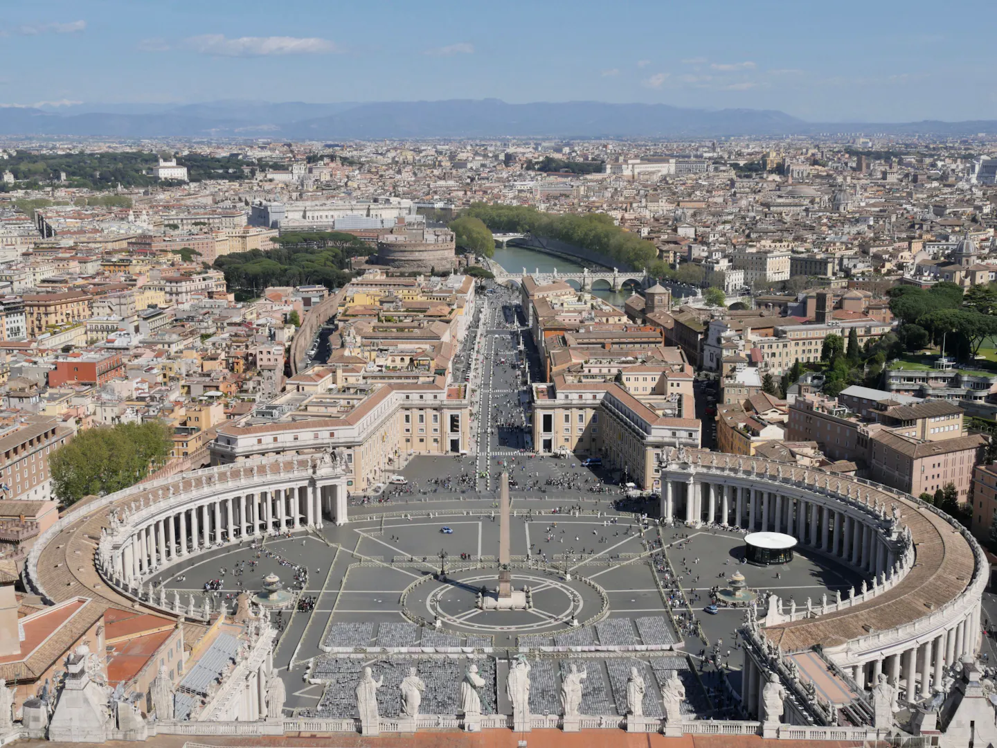 St Peter's Square with its elliptical colonnade and obelisk, Via della Conciliazione and the rooftops of Rome seen from the top of St Peter's Dome
