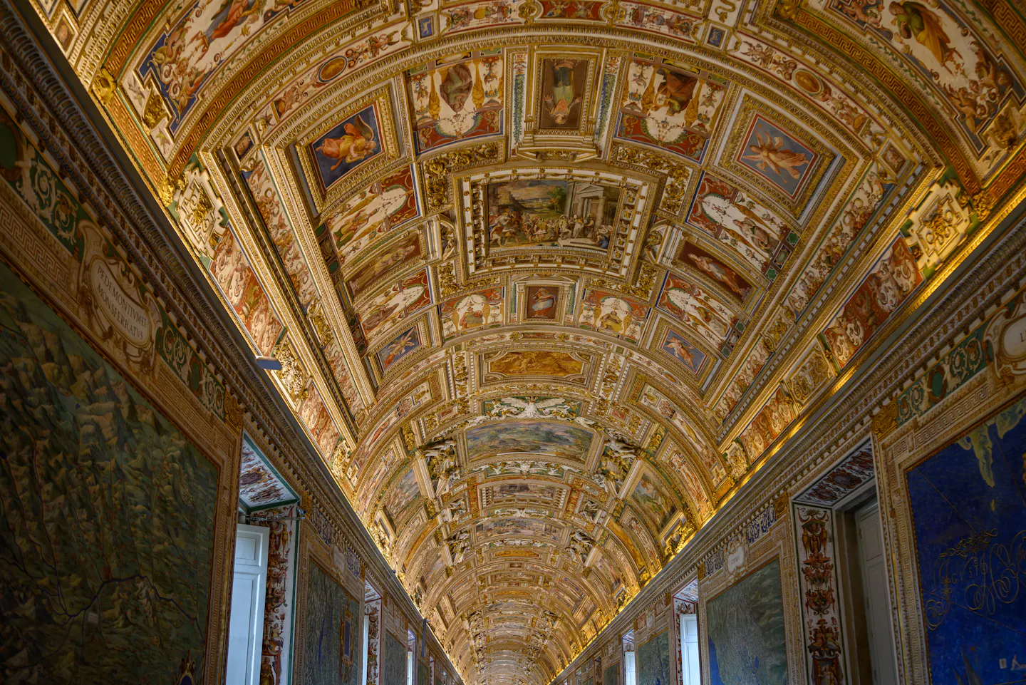 The gilded, fresco-covered vaulted ceiling of the Gallery of Maps in the Vatican Museums