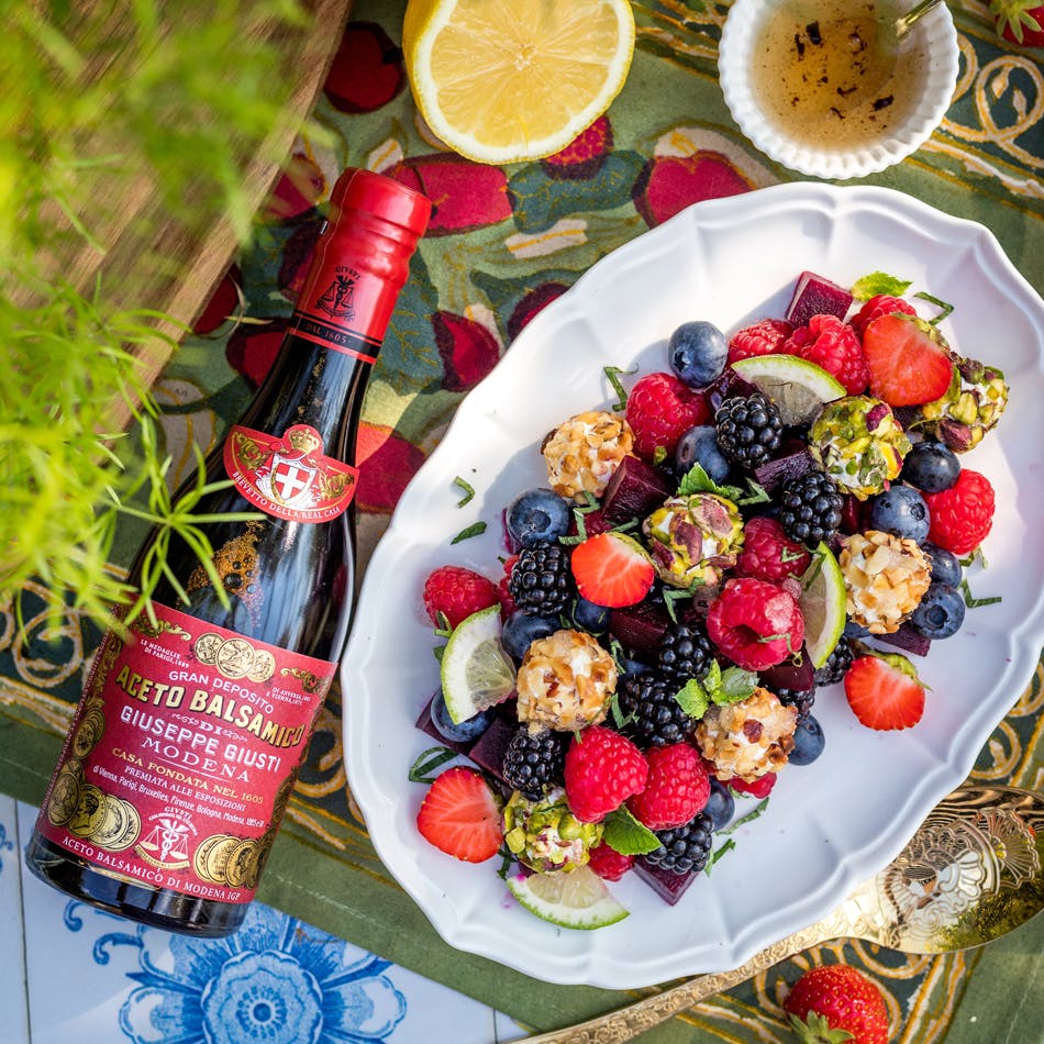 Beetroot salad with red berries and sweet cheese balls