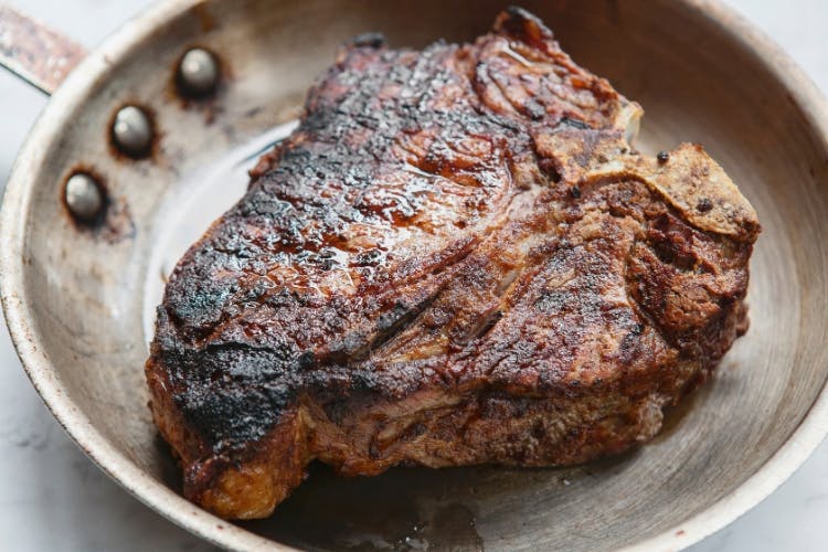 seared steak in pan