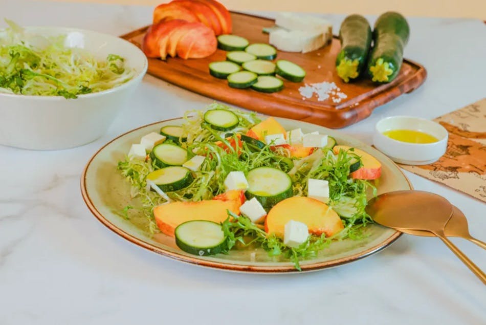 Peach and zucchini salad with cheese