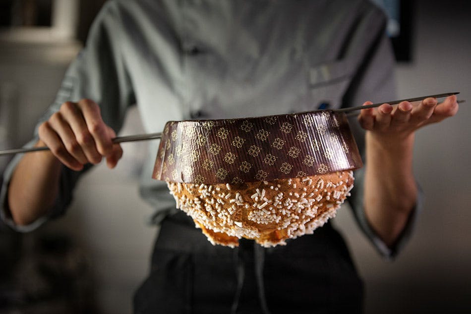 Cooling panettone on skewers