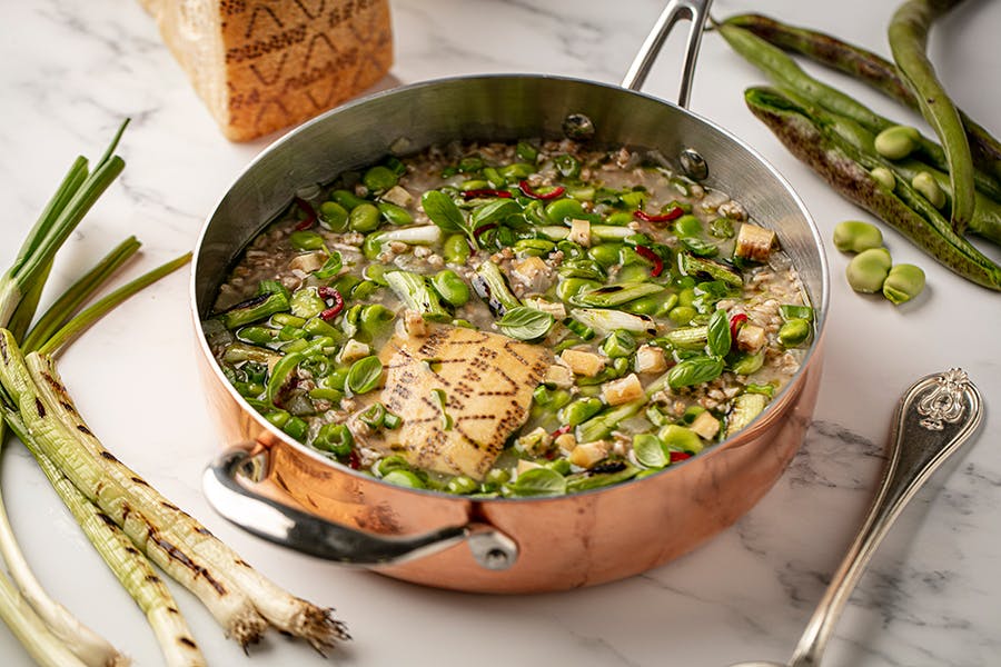 Grana Padano, spelt and broad bean soup