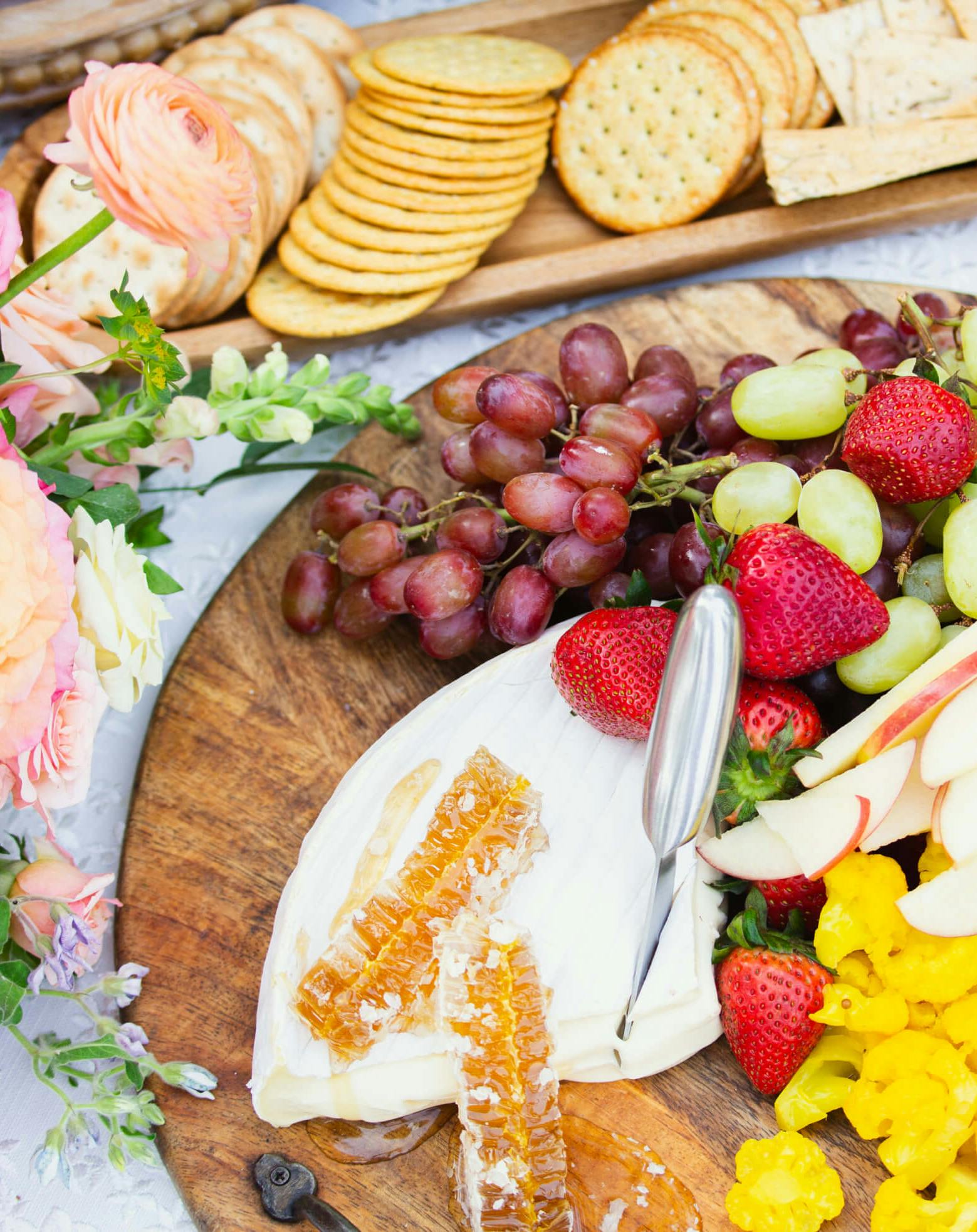 Market board with cheeses and fruit