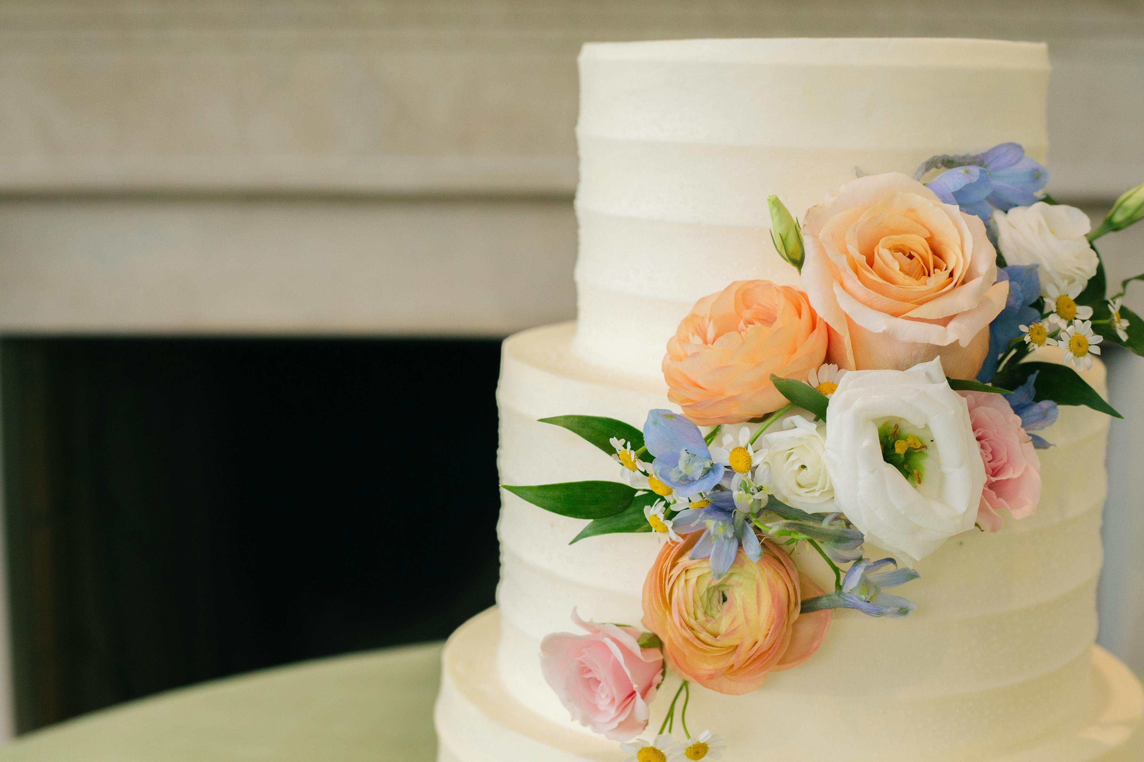 wedding cake garnished with flowers 