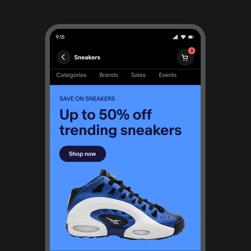 Example of a banner in dark mode with the page title in white on a black background. The banner is the same blue mobile shopping banner features a blue, black, and white sneaker. Text reads, “Save on sneakers. Up to 50% off trending sneakers,” with a “Shop now” button.