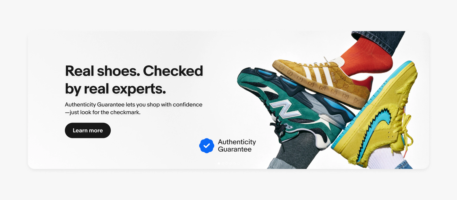 A large product banner with text on the left side containing a headline, subline, and cta button. The image contains a neutral background with 3 types of shoes. The program badge is randomly placed on the middle of the banner.
