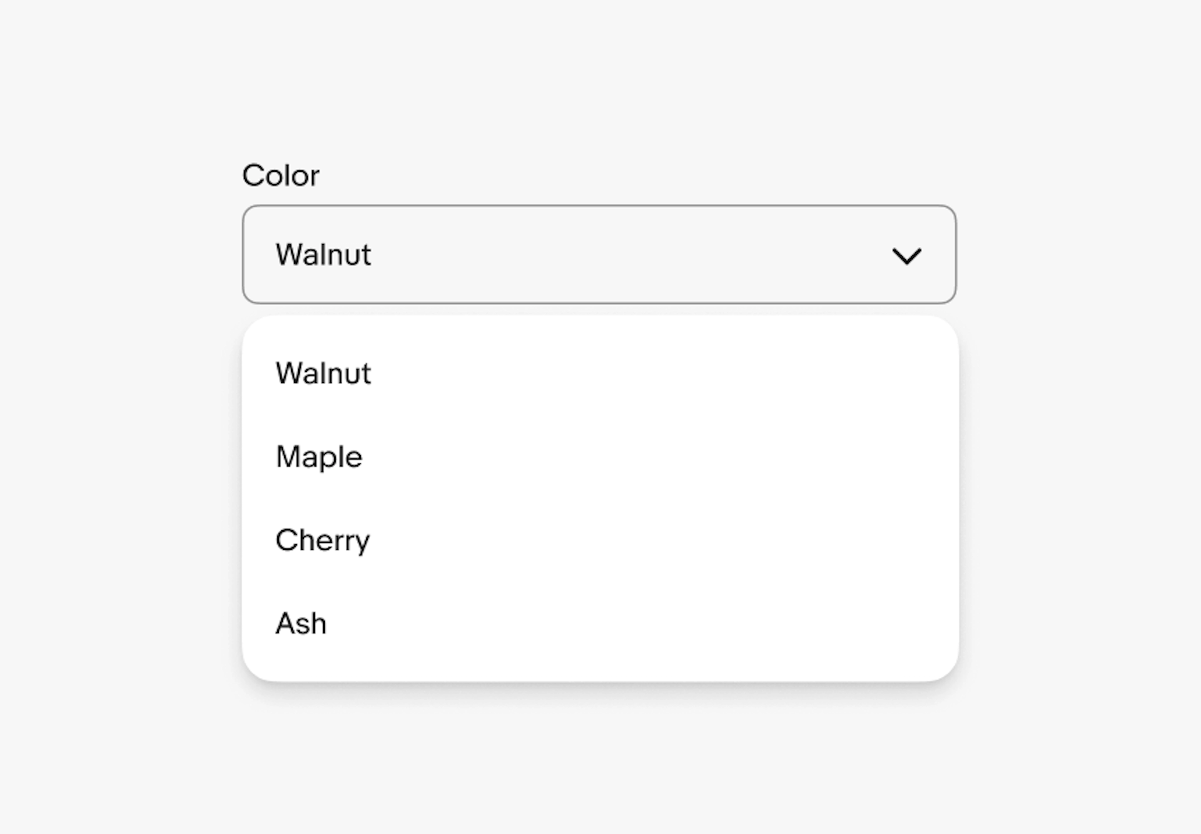 A ‘Color’ label sits above a dropdown. The dropdown has the following options listed, “walnut”, “maple”, “cherry” and “ash”. “Walnut” is selected”. 