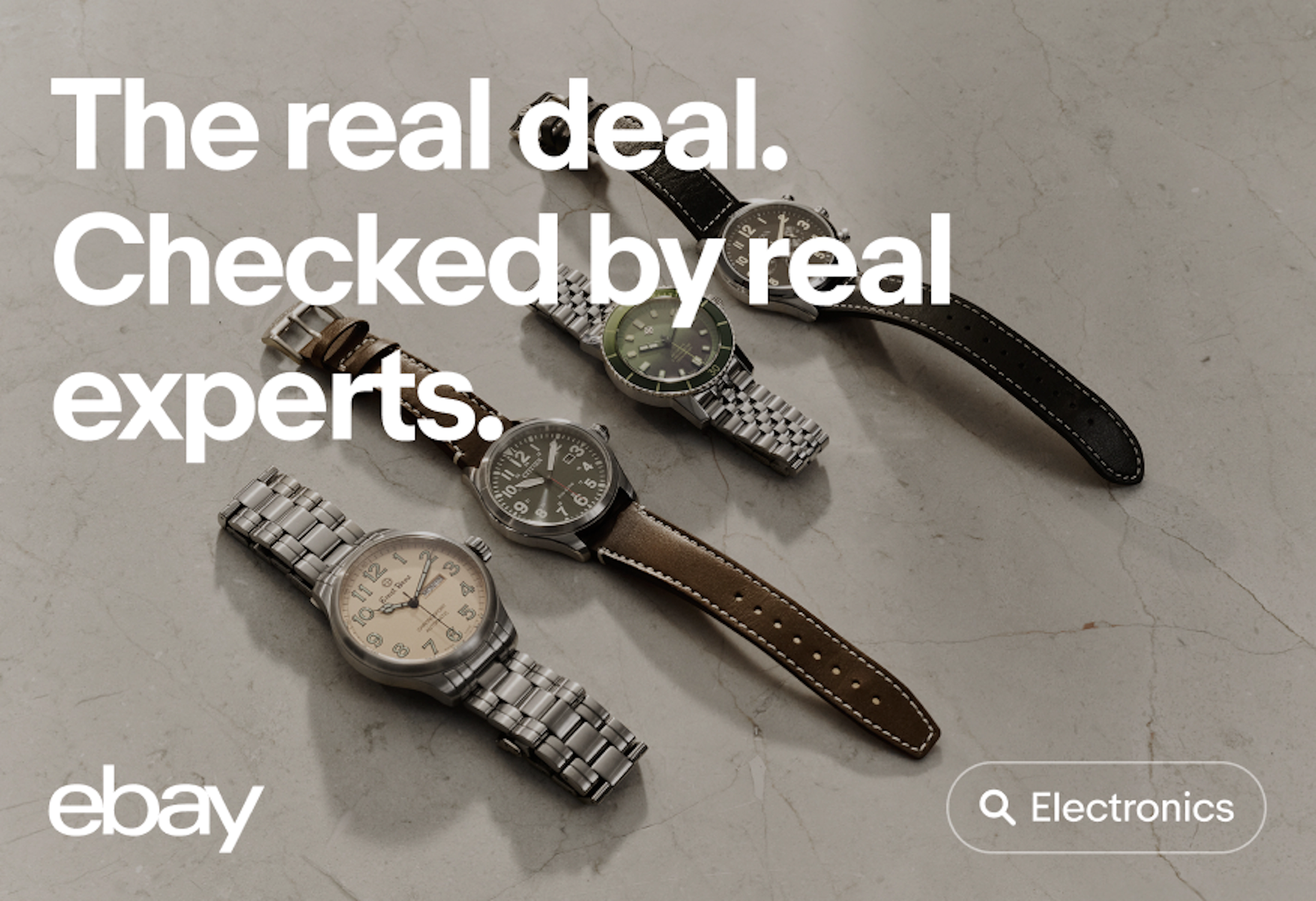 A promotional graphic featuring the headline "The real deal. Checked by real experts." above four wristwatches displayed on a stone surface, with eBay branding and a search bar labeled "Electronics."