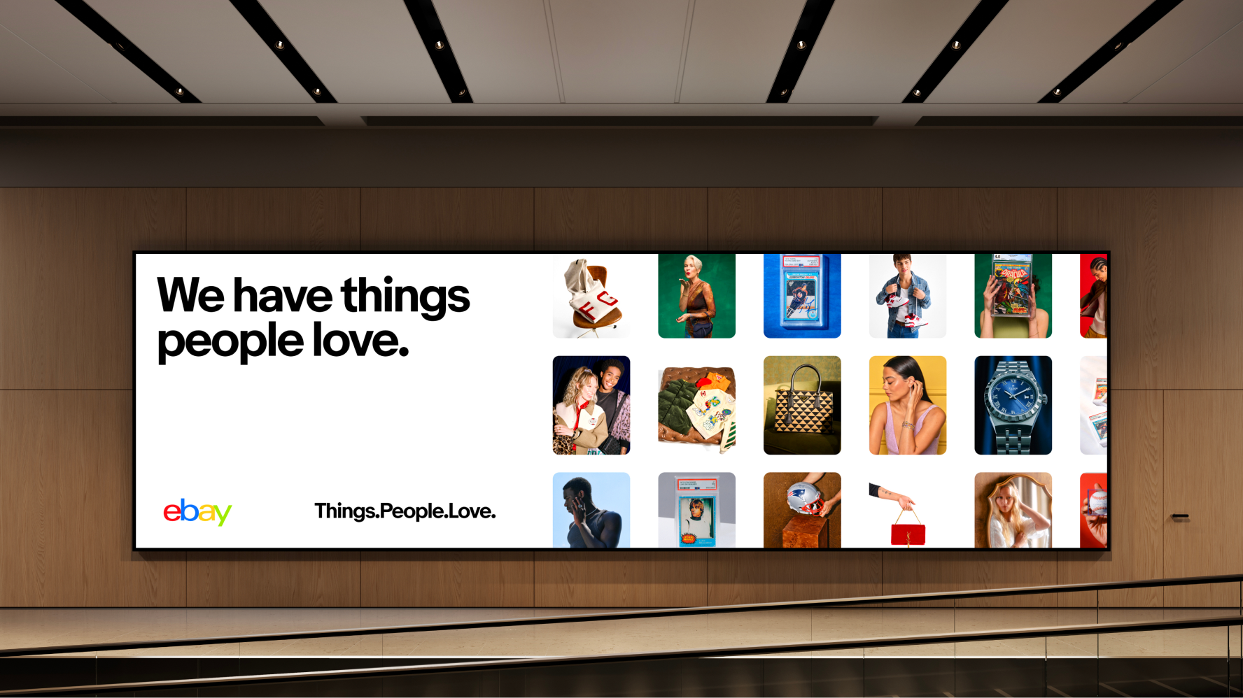 A long billboard displaying a catalog grid of photos of various product categories with black text on the top left, heritage eBay logo on bottom left and our tagline centered.