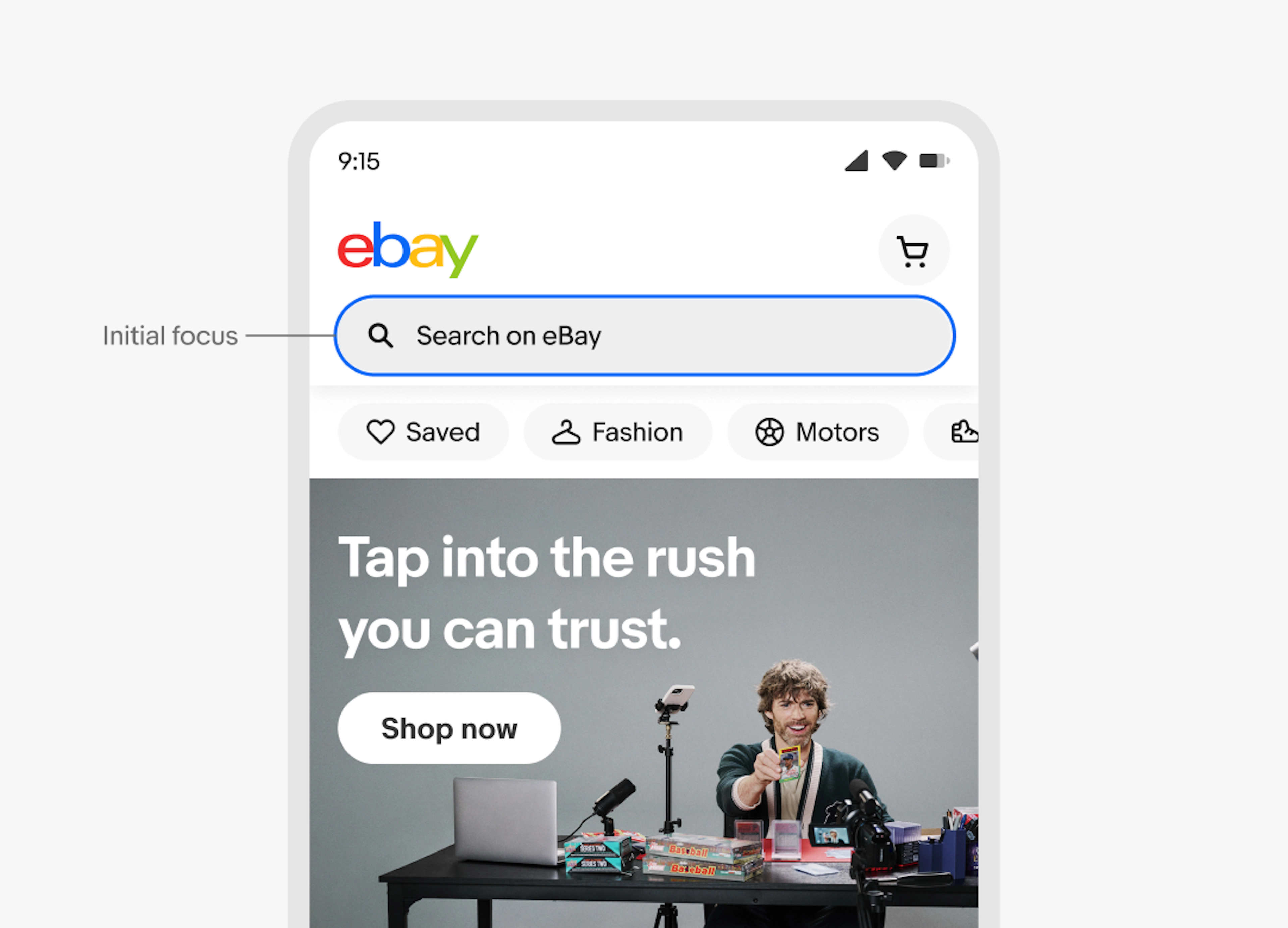 A mobile app screen with the eBay homepage highlighting the search bar as the initial keyboard focus, featuring the annotation "Initial focus" pointing to the search field above category shortcuts and a promotional banner.