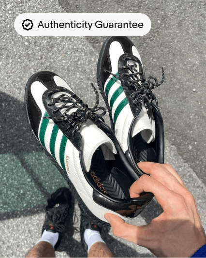 A full bleed overhead shot of a person holding a pair of Adidas sneakers with a UI badge in the upper left corner.