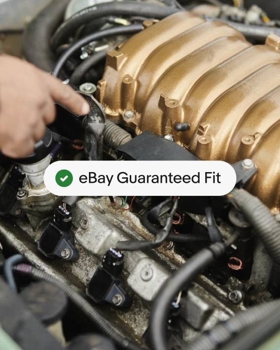 A full bleed image of an engine with a full logo UI badge centered over it.