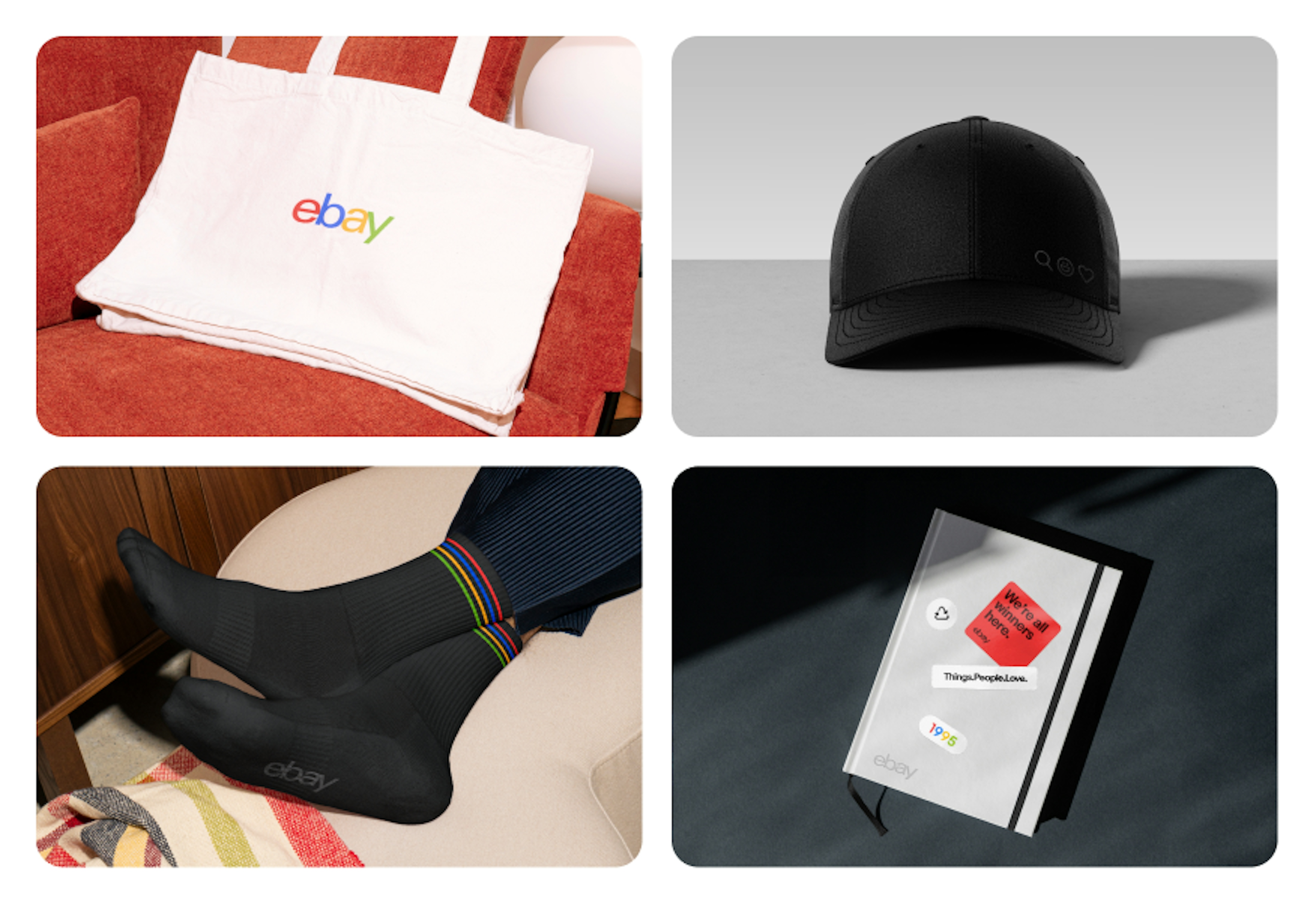 A set of 4 pieces of merchandise including a white tote with the 4-color logo front and center, a white notebook with an embossed logo in the corner, black socks with a tonal logo on the bottom, and a black cap with a hidden logo.