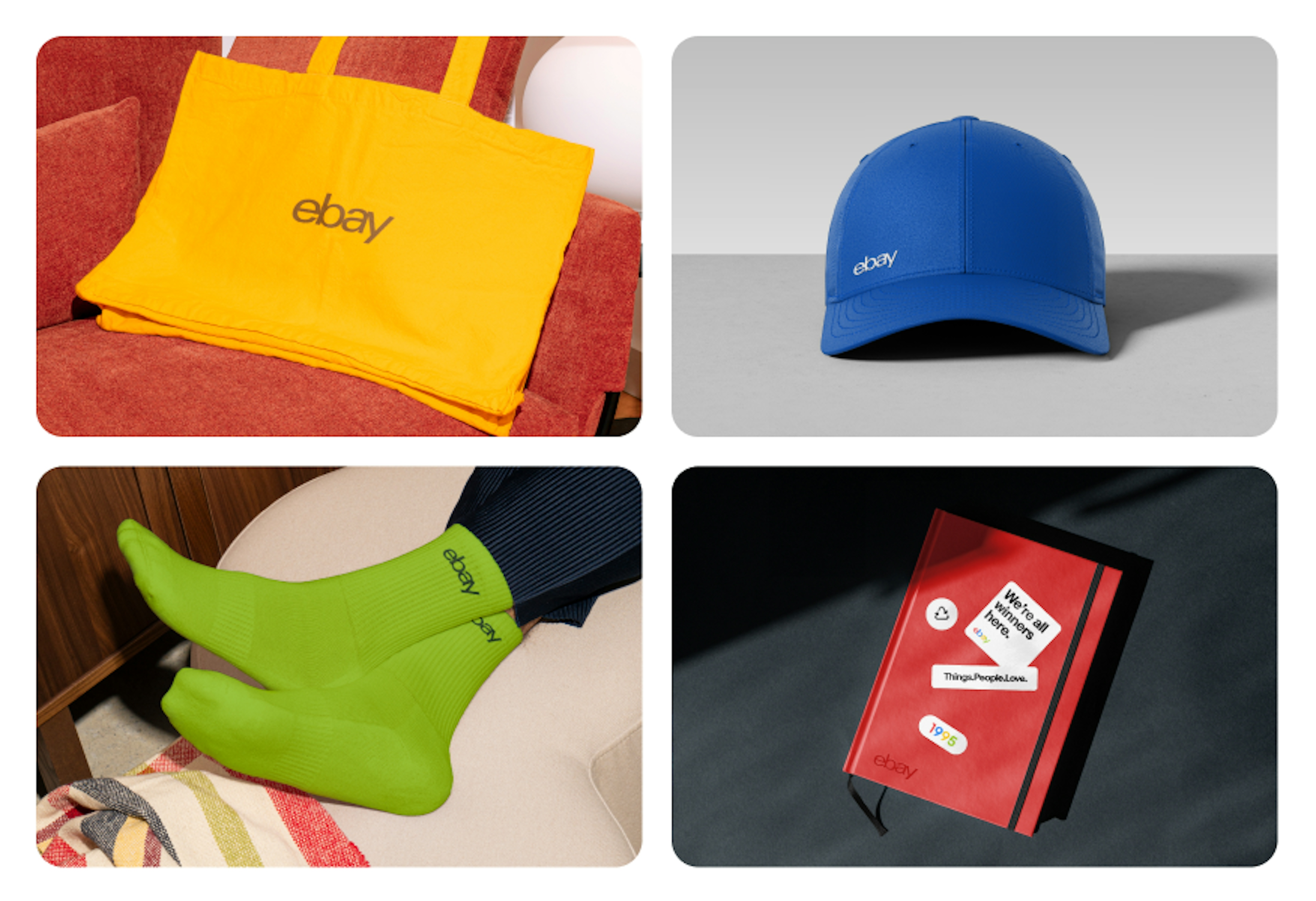 A set of 4 pieces of merchandise including a yellow tote with a dark tonal logo front and center, a red notebook with an embossed logo in the corner, green socks with a dark tonal logo towards the top edge, and a blue cap with a tonal logo on the front.
