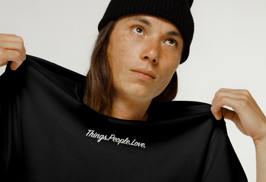 A black t-shirt with our tagline “Things.People.Love.” printed on the front chest area in a script font.