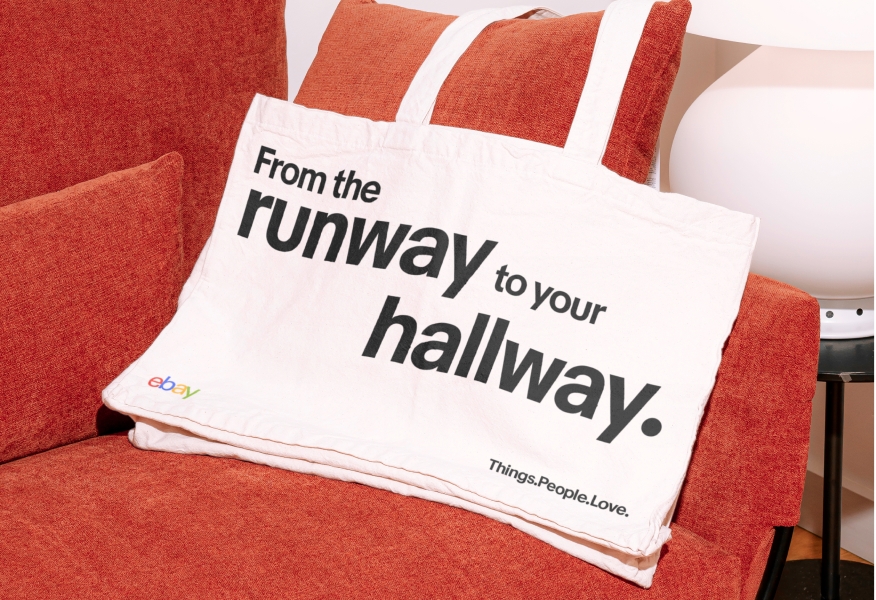 A tote bag with “From the runway to your hallway.” in Market Sans Bold, with “runway” and “hallway” being typeset much larger than the rest of the words.