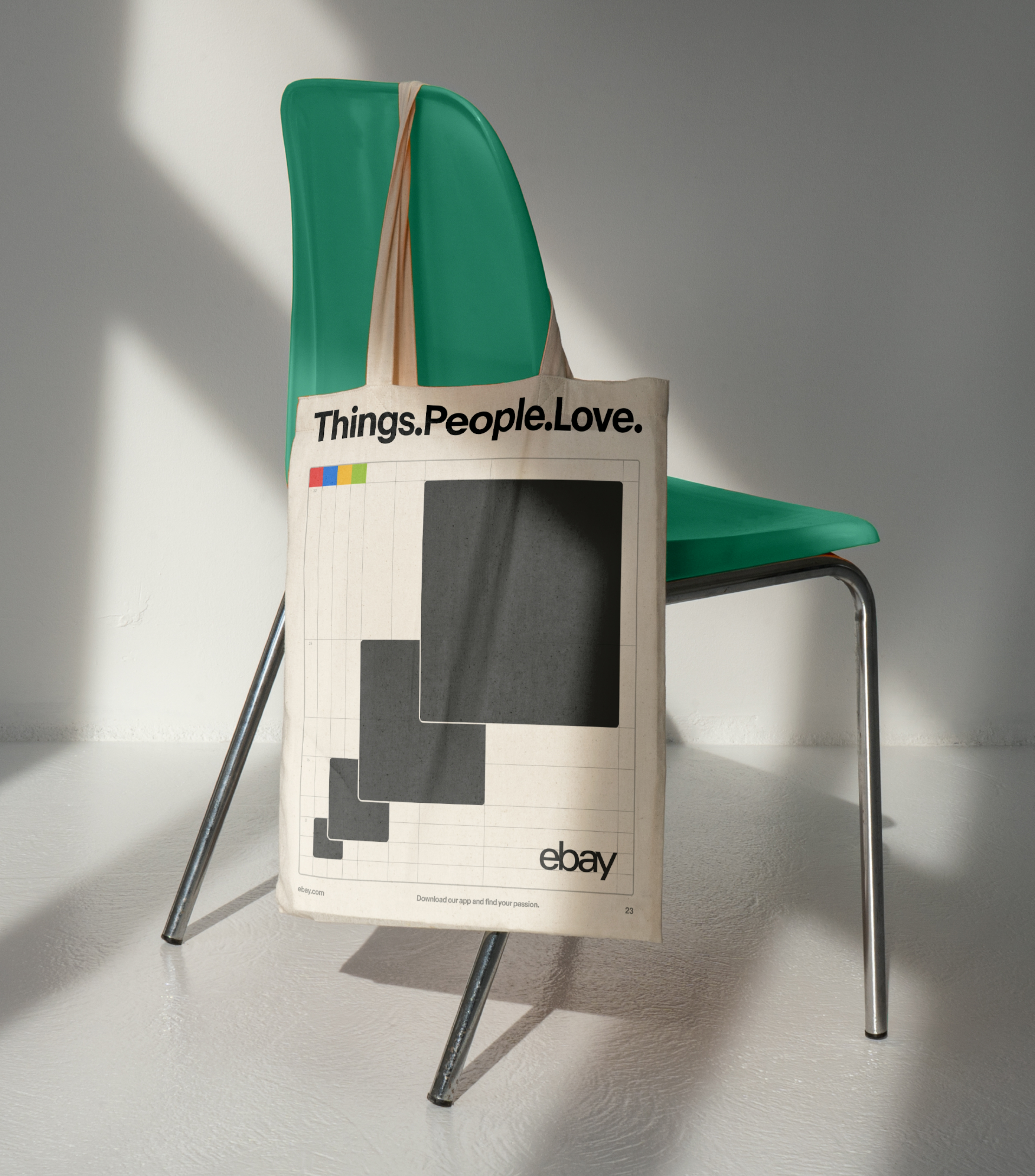 A graphic tote bag with "Things.People.Love" hanging over the back of a bright green chair.