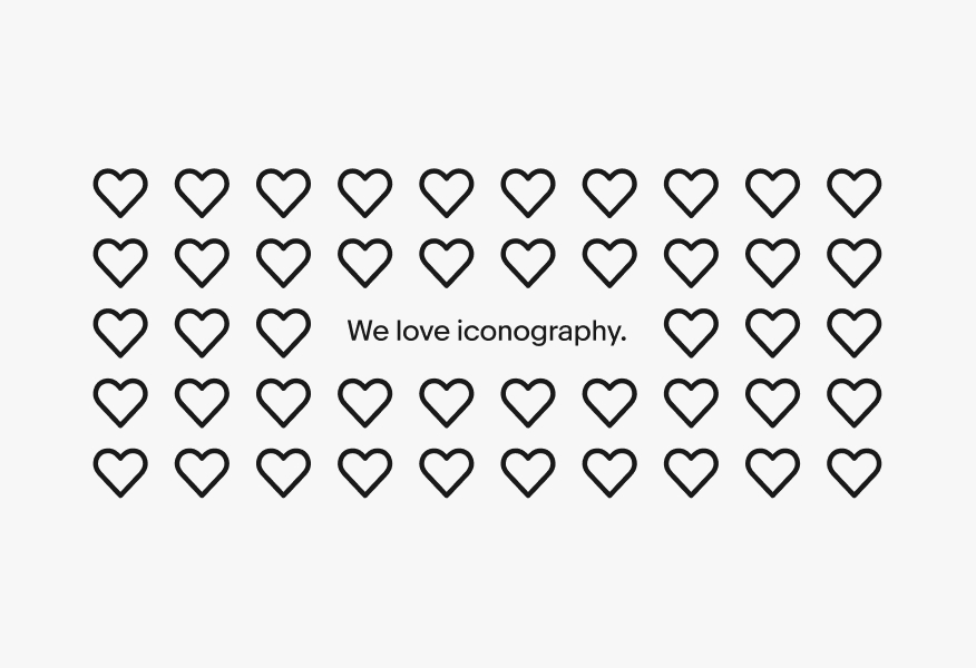 A grid of heart icons forming an image with the text “we love iconography” inside.