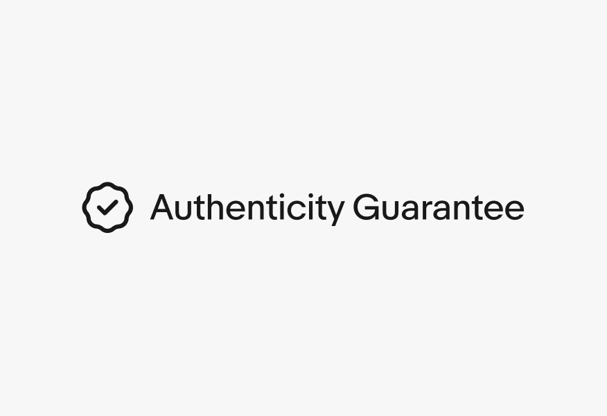 A rosette checkmark icon next to a single line of text “Authenticity Guarantee”.